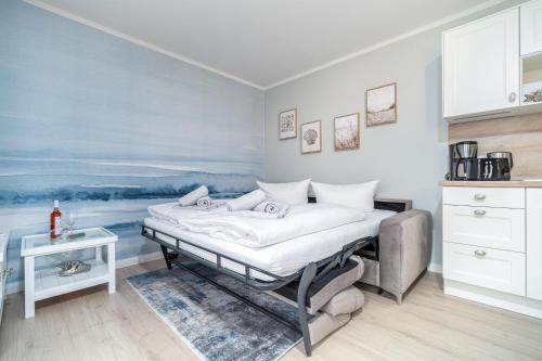 Postel nebo postele na pokoji v ubytování Ferienhaussiedlung Strandperlen Sanddornhof 2d (Typ I)