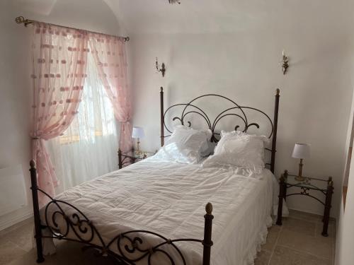 Ένα ή περισσότερα κρεβάτια σε δωμάτιο στο Casa Rosa