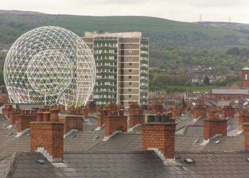 a view of a city with a large white dome at Lights of Broadway Gaeltacht Quarter in Belfast