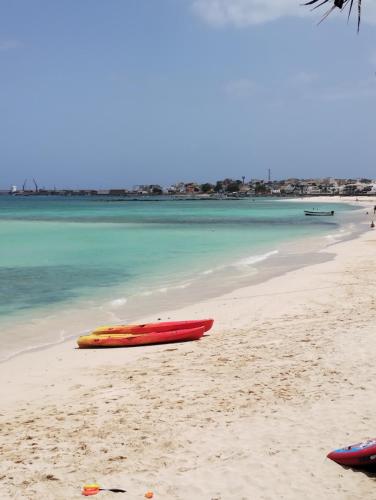 a couple of boats sitting on a beach at Boadream Casa Duria Porta Viola in Prainha