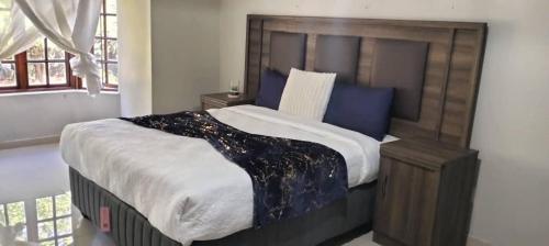 Katil atau katil-katil dalam bilik di The Haven Guesthouse Ezulwini