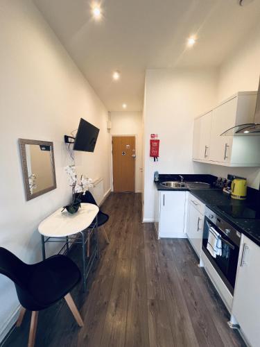 Kuchyň nebo kuchyňský kout v ubytování Fox House Studios, Aparthotel