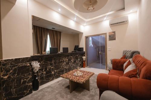 a living room with a couch and a table at The View Pyramids Gold Two in Cairo