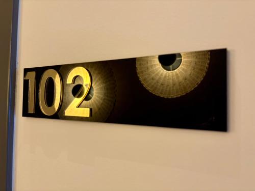 a picture of a clock with the number on it at Regina Elena Suites & Private SPA in Sannicola