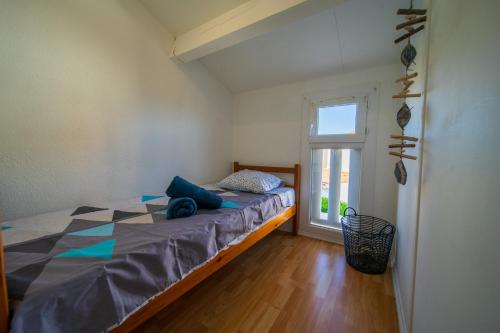 En eller flere senge i et værelse på Maison au bord du bassin de Thau