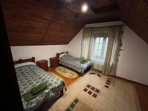 En eller flere senge i et værelse på Вілла Білий Бізон Хмелева