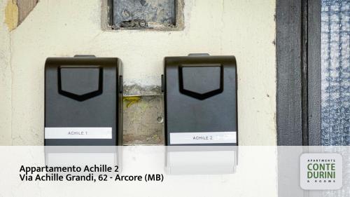 two mail boxes on the side of a wall at Conte Durini Apartments & Rooms in Arcore