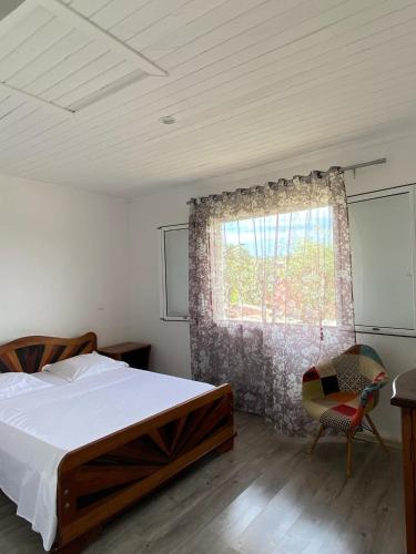 Postel nebo postele na pokoji v ubytování Appartements Tsy kivy