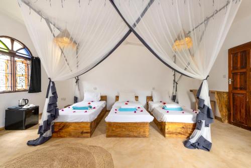 Кровать или кровати в номере Tunda Lodge