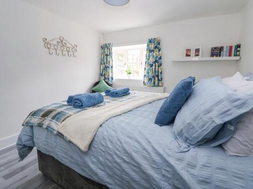 Voodi või voodid majutusasutuse Cuddfan at Swallow Cottage toas