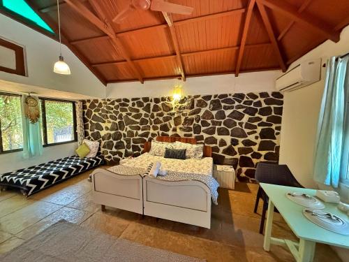 a living room with a bed and a table at Captans Stay in Lonavala