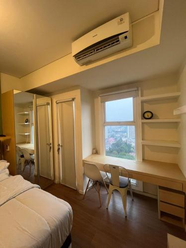Ένα ή περισσότερα κρεβάτια σε δωμάτιο στο Simply Studio Apartment