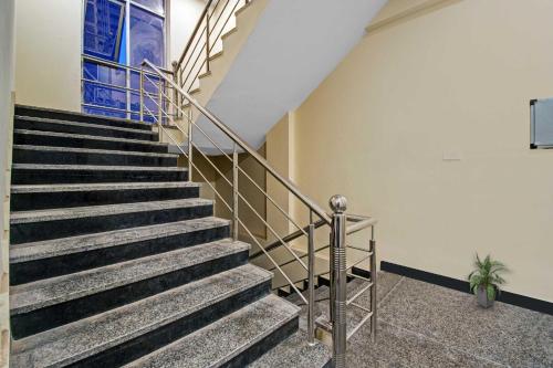 a staircase in a building with a stair case at Collection O Aloft in Jaipur