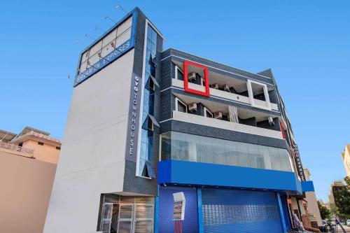 a building with a blue and white facade at Collection O Aloft in Jaipur