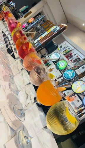 a group of bottles and glasses on a counter at Thomas Arms Hotel in Llanelli