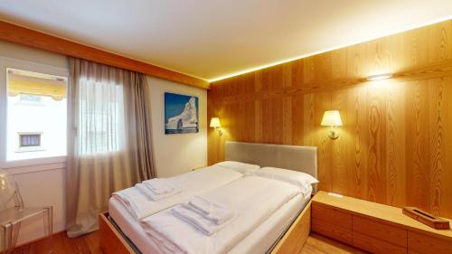 Postel nebo postele na pokoji v ubytování Abitaziun Suot Larsch 4 1 - Celerina