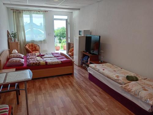 A bed or beds in a room at Apartmany Fantagiro