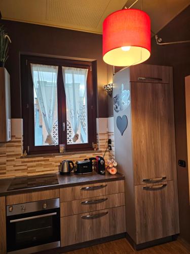 Kuchyň nebo kuchyňský kout v ubytování Ampio Attico vista Forum & Metro