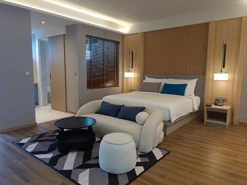 เตียงในห้องที่ Lalynn Resort & Villas, Phuket