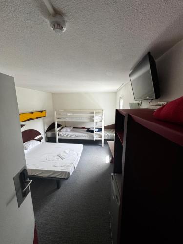 Letto o letti in una camera di Lidotel