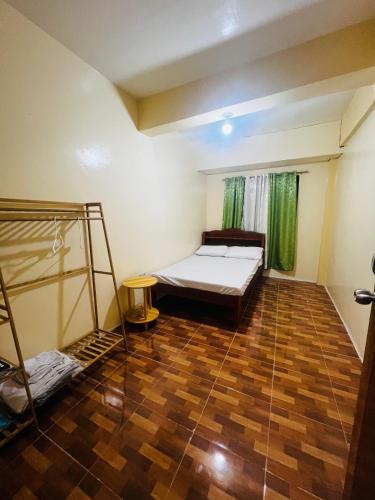 a room with a bed and a ladder in it at Brklyn Homestay in Banaue