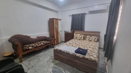 Postel nebo postele na pokoji v ubytování ShivSangit HomeStay