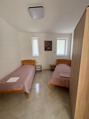 Postel nebo postele na pokoji v ubytování PálmaLak