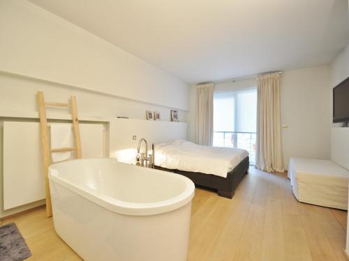 Ένα ή περισσότερα κρεβάτια σε δωμάτιο στο Apartment in Duinbergen by the Seafront