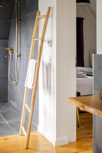 a ladder in a bathroom next to a shower at Wohnen wie im Schloss - Alter Bahnhof von Kruft in Kruft