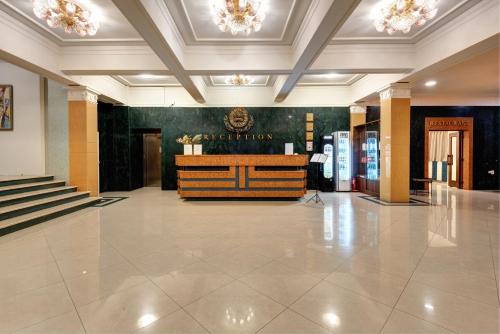 a lobby with a reception desk in a building at Park Hotel Kaylaka in Pleven