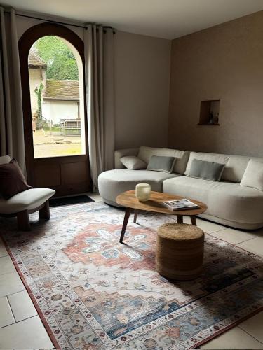 a living room with a couch and a coffee table at Castel Rochefort sur Nenon Jura in Rochefort-sur-Nenon