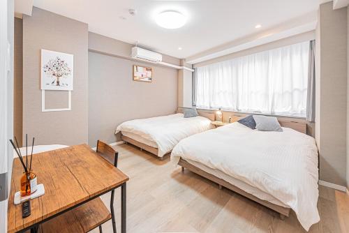 Postel nebo postele na pokoji v ubytování jinbocho str walk 6 min ,4 floors building 4dk for 13 person, 新宿駅12分 秋葉原5分 東京駅7分 銀座駅7分 渋谷20分