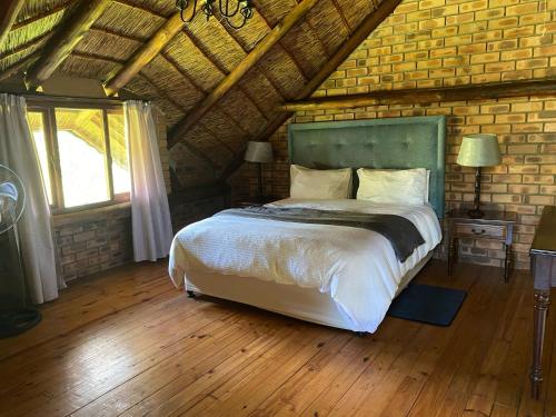Ένα ή περισσότερα κρεβάτια σε δωμάτιο στο Crocriver Chalet Schoemanskloof
