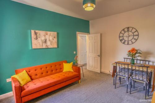 a living room with a couch and a table at The Burradon Burrow in Annitsford Station