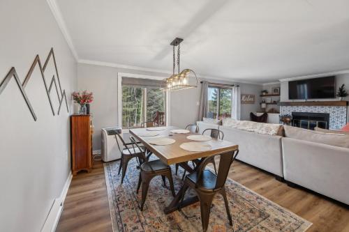 a dining room and living room with a table at Twin Fawns in North Creek