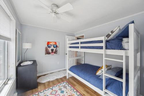 a bedroom with two bunk beds and a ceiling at Twin Fawns in North Creek
