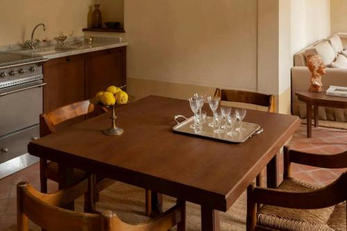 a wooden table with glasses on it in a kitchen at Hôtel du Couvent, a Luxury Collection Hotel, Nice in Nice