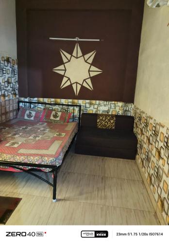 a room with two beds and a star on the wall at SIDHU GUEST HOUES -400 walking distance From golden Temple in Amritsar