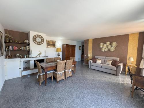 a living room with a couch and a table at Sunderville Superior in Peschici