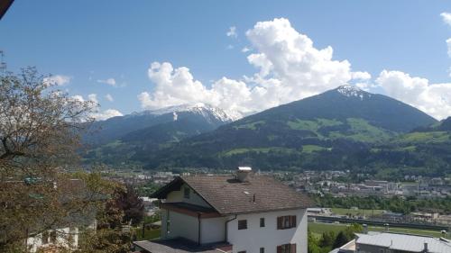 a view of a mountain range with a house at Ferienwohnung Rosa in Fritzens