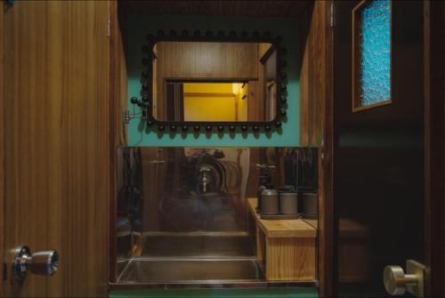 a bathroom with a sink and a mirror at Unique City Pop Retreat 5 star Location, Game Room in Fujiyoshida