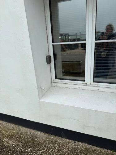 an open door of a building with a window at Maison vue Mer Ile de Ré - Rivedoux-Plage - Villa Raie Manta - Ile de Ré - 4 chambres - 2 salles d eau - 1 à 8 personnes - Plage à pied in Rivedoux-Plage