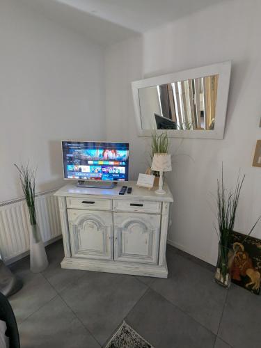 a white desk with a computer on top of it at Klagenfurt Apartment in Klagenfurt