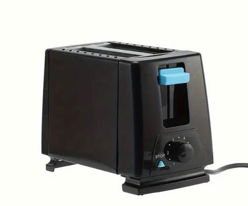 a black toaster oven with a cord plugged into it at Maison vue Mer Ile de Ré - Rivedoux-Plage - Villa Raie Manta - Ile de Ré - 4 chambres - 2 salles d eau - 1 à 8 personnes - Plage à pied in Rivedoux-Plage
