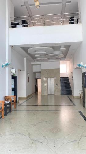 an empty room with a staircase in a building at hotel sonamina in Samayapuram