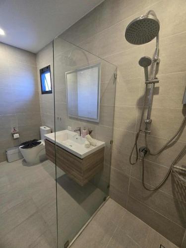 a bathroom with a sink and a glass shower at Private villa near beach Koh Samui in Koh Samui