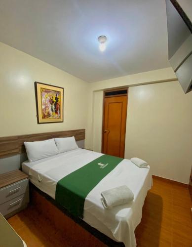 Ένα ή περισσότερα κρεβάτια σε δωμάτιο στο Hotel San Eduardo