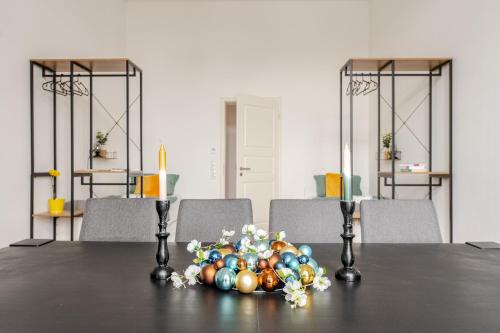 a table with a bowl of eggs on a table at Wohnen wie im Schloss - Alter Bahnhof von Kruft in Kruft