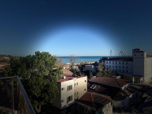 a view of a city with the ocean in the background at ORA SeaView in Balchik