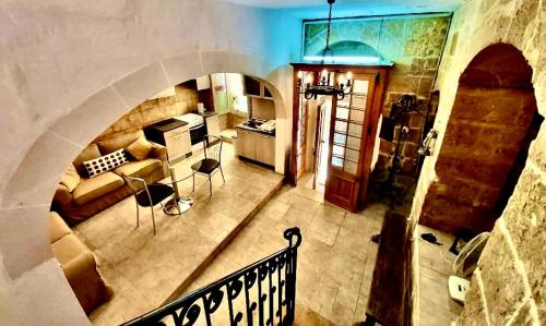 an overhead view of a kitchen and a living room at 300 years old Maisonette in Beautiful Stairs in Valletta